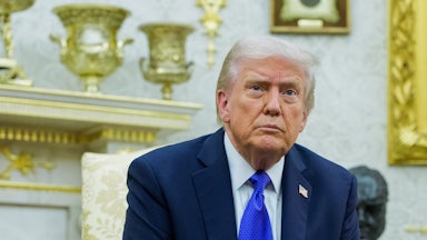 Donald Trump sits in his gold-filled Oval Office.