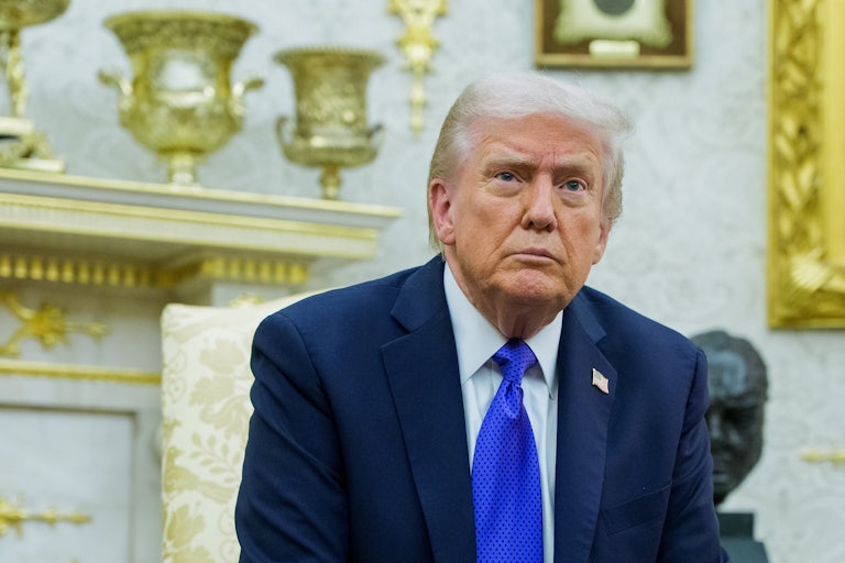 Donald Trump sits in his gold-filled Oval Office.