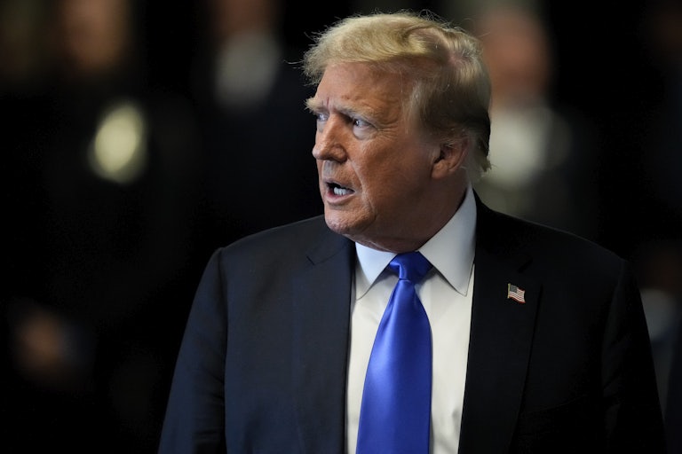 Donald Trump speaks and looks to the side (profile shot)