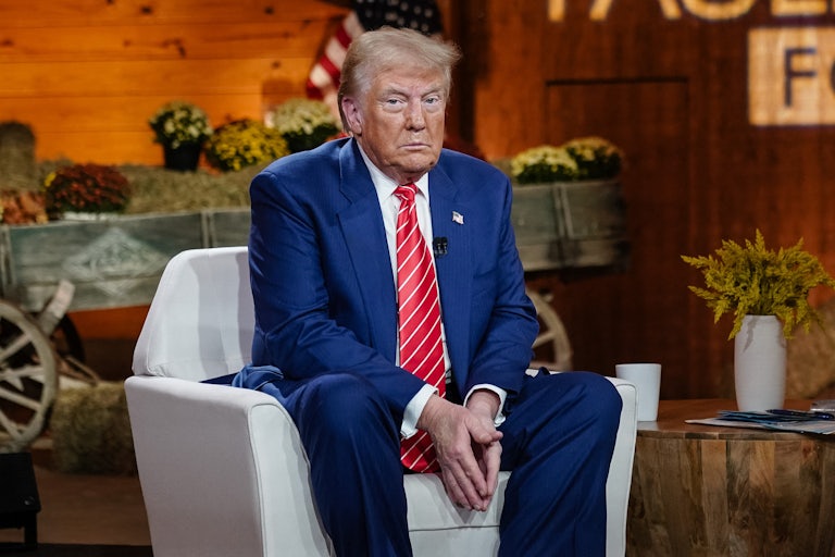 Donald Trump sits on stage before his town hall discussion