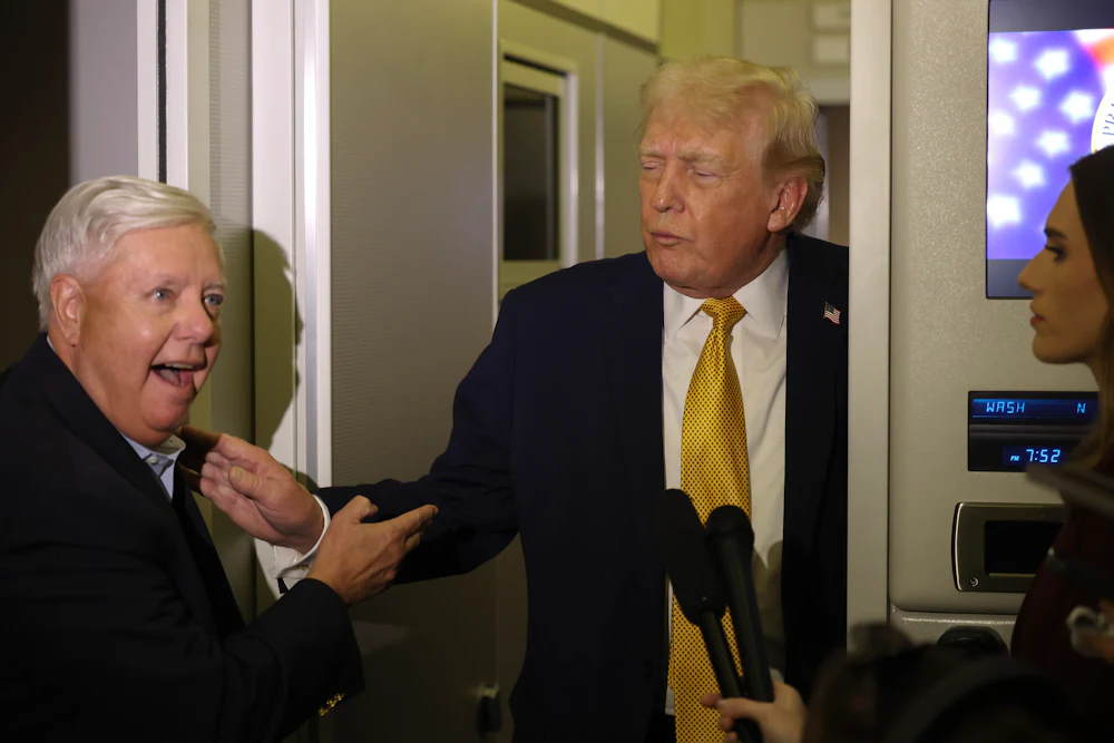 President Trump and Senator Lindsey Graham aboard Air Force One in January