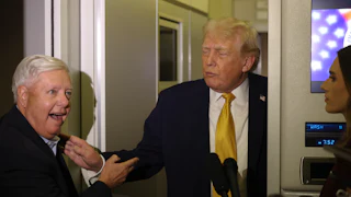 Senator Lindsey Graham and Donald Trump stand next to each other while speaking to reporters on Air Force One.