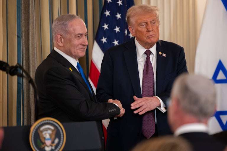 Israeli Prime Minister Benjamin Netanyahu and Donald Trump shake hands at a press conference