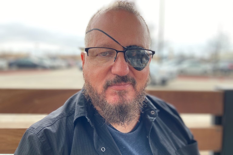 Oath Keepers founder Stewart Rhodes (wearing an eyepatch on his left eye)