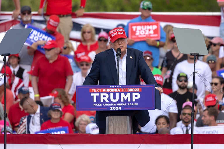 Donald Trump speaks at a podium