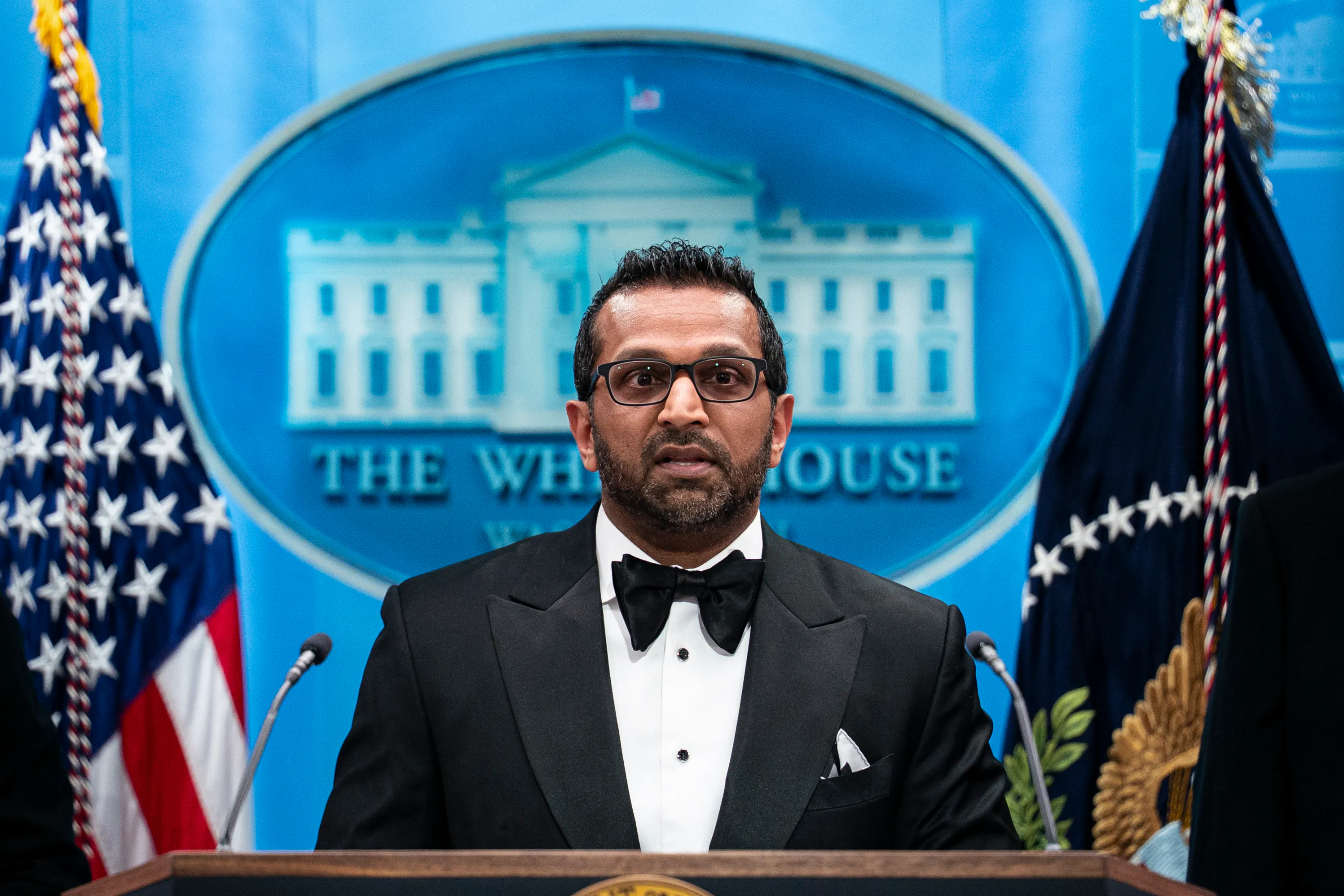FBI Director Kash Patel speaks at a podium