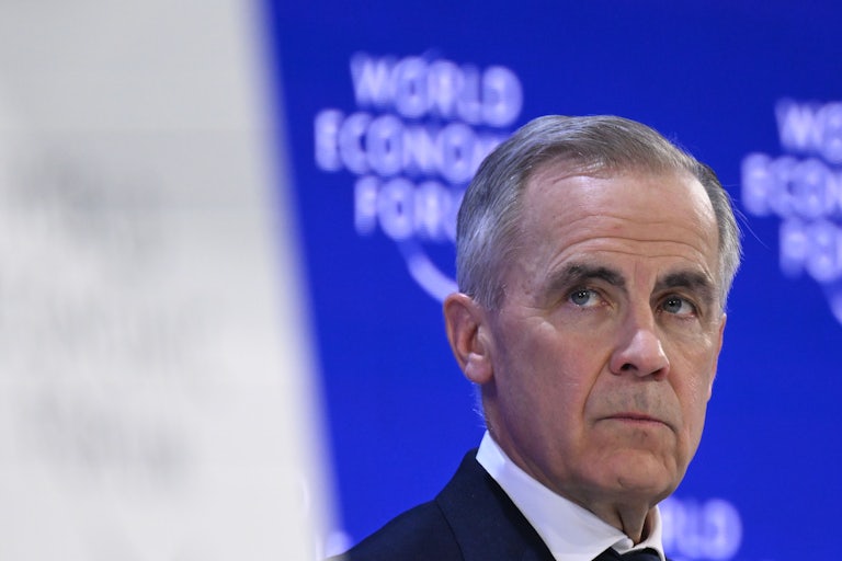 Canadian Prime Minister Mark Carney stands on stage at the World Economic Forum in Davos