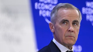 Canadian Prime Minister Mark Carney stands on stage at the World Economic Forum in Davos