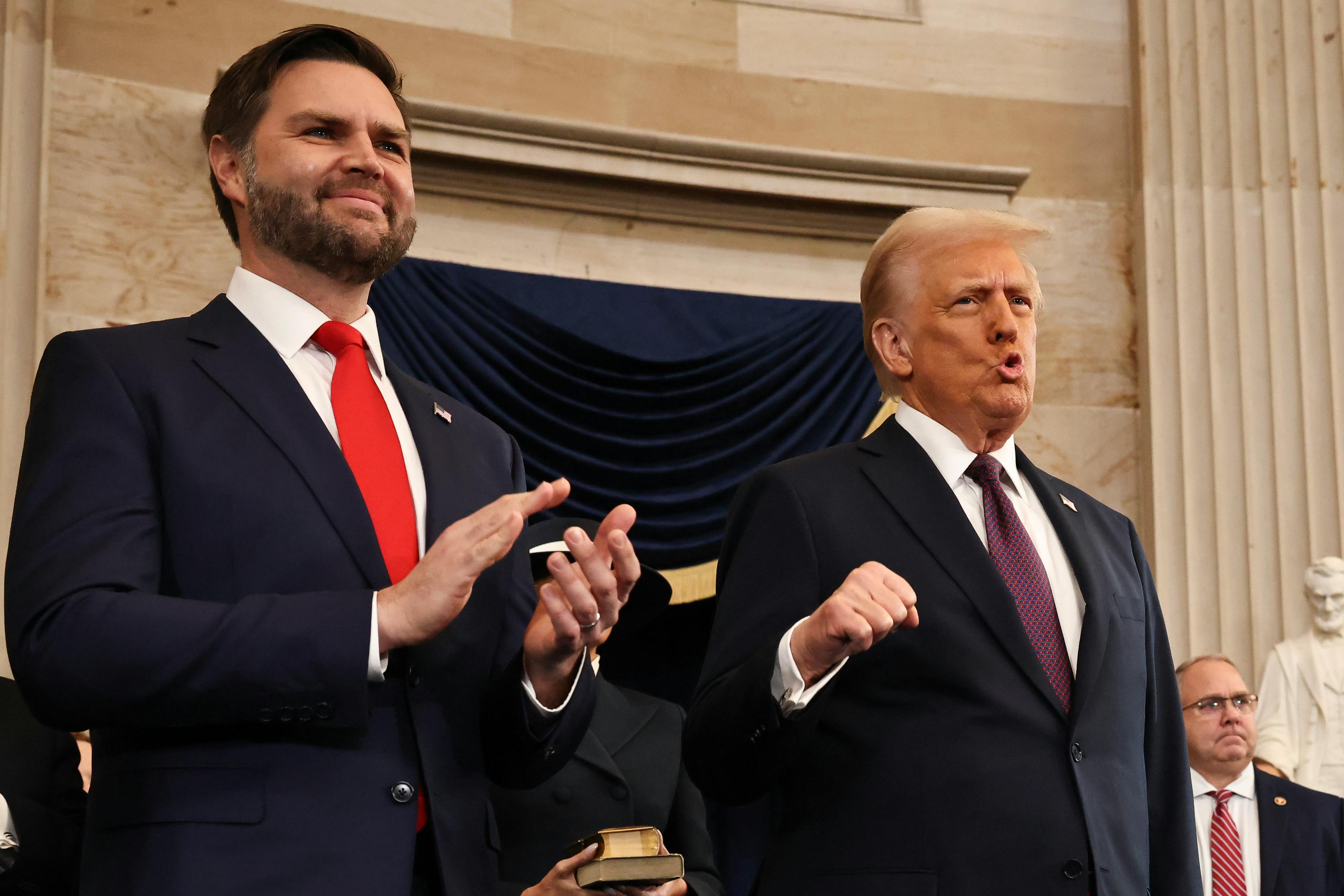 Vice President JD Vance claps as President Donald Trump cheers during his inauguration.