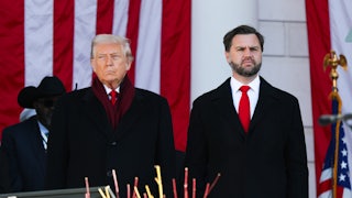 Donald Trump and JD Vance stand next to each other during a Veterans Day event at Arlington National Cemetery