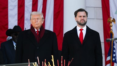 Donald Trump and JD Vance stand next to each other during a Veterans Day event at Arlington National Cemetery