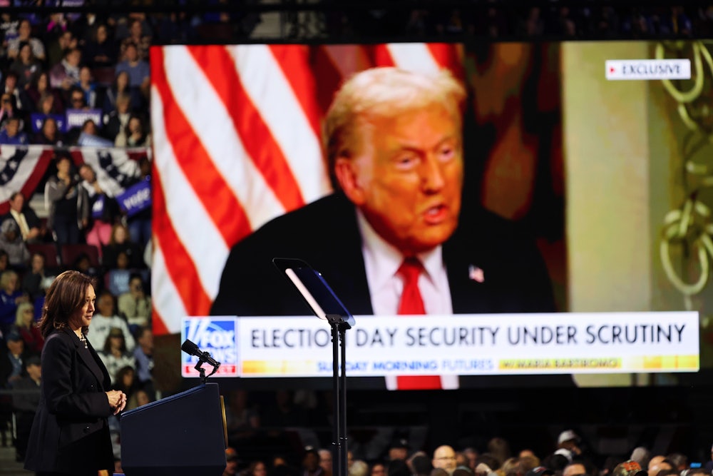 Kamala Harris watches a video of Donald Trump during a campaign rally at Erie Insurance Arena in Erie, Pennsylvania, on October 14.