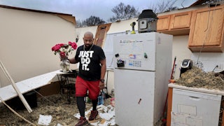 Man salvages belongings from his destroyed home after severe weather in Greater St. Louis