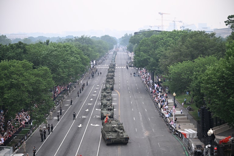 Sparse crowds watch armored vehicles participate in the Army 250th Anniversary Parade, which coincided with Donald Trump's birthday