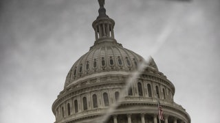 The dome of the U.S. Capitol is reflected in displaced stone, making it look like there's a crack running through it.