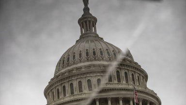 The dome of the U.S. Capitol is reflected in displaced stone, making it look like there's a crack running through it.