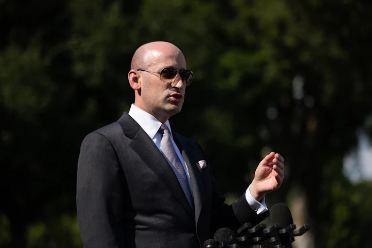 Stephen Miller gestures while speaking outside the White House