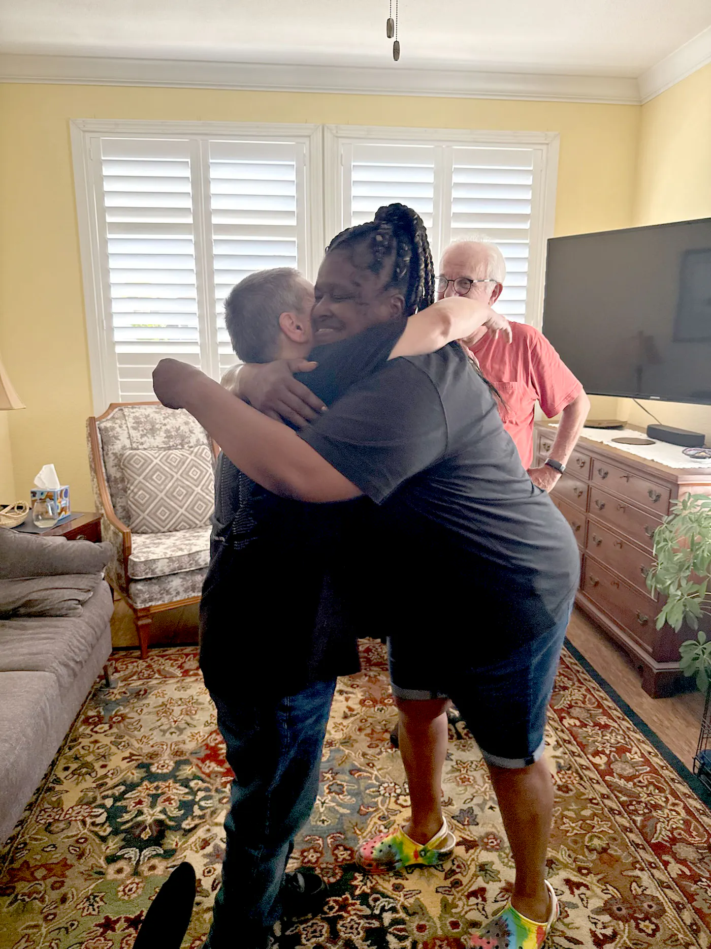 TC hugs someone after she was released in March 2021. 