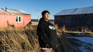 A portrait of RaShawn Foxglove who is a cashier at Ransom’s Grocery Store in Unalakleet, Alaska, photographed outside