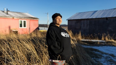 A portrait of RaShawn Foxglove who is a cashier at Ransom’s Grocery Store in Unalakleet, Alaska, photographed outside