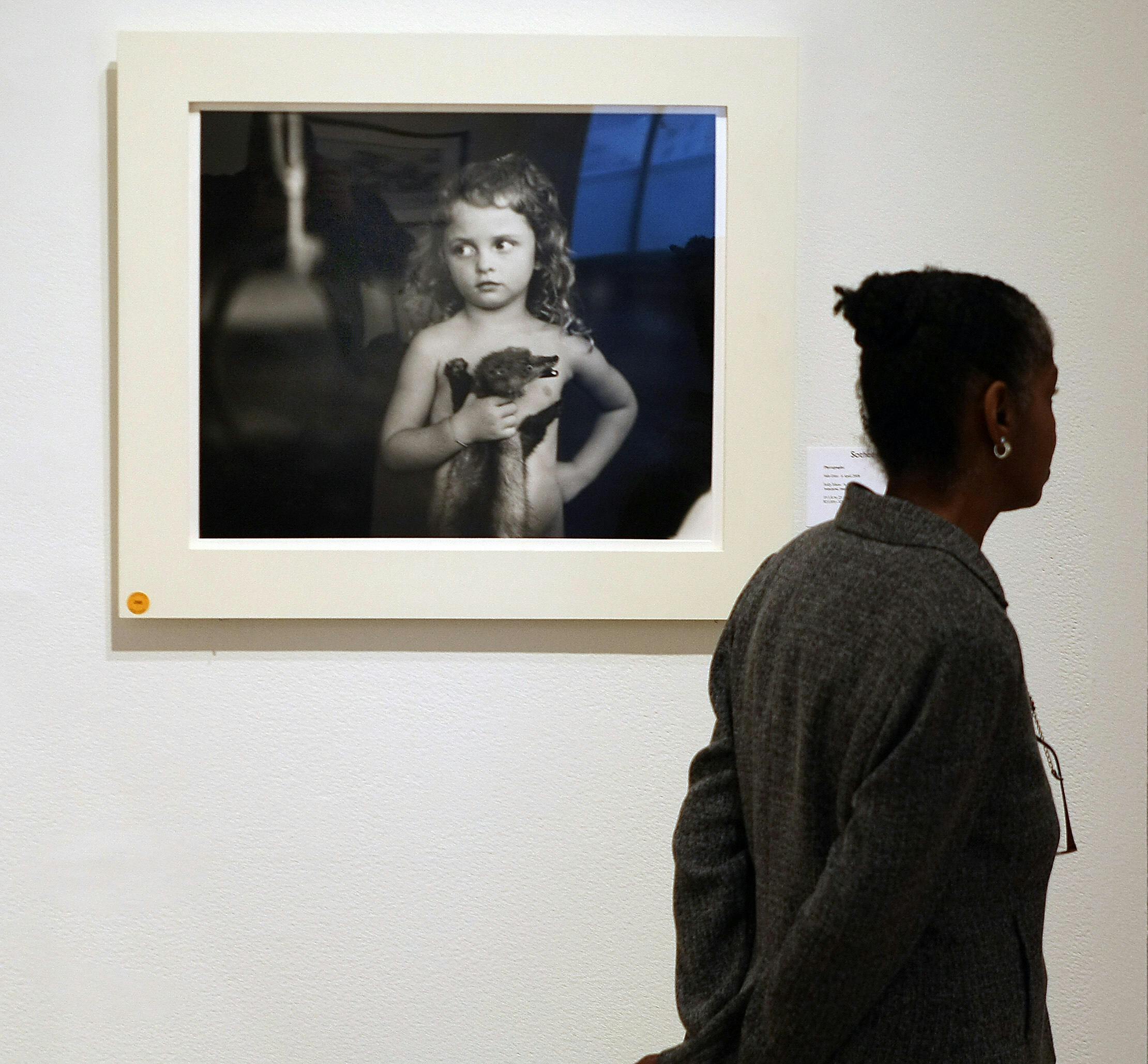 “Holding the Weasel,” a photo from Sally Mann’s collection “Immediate Family"