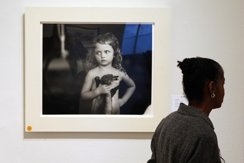 “Holding the Weasel,” a photo from Sally Mann’s collection “Immediate Family"