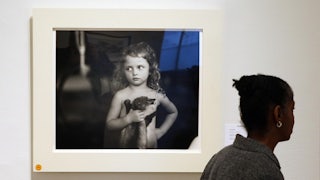“Holding the Weasel,” a photo from Sally Mann’s collection “Immediate Family"