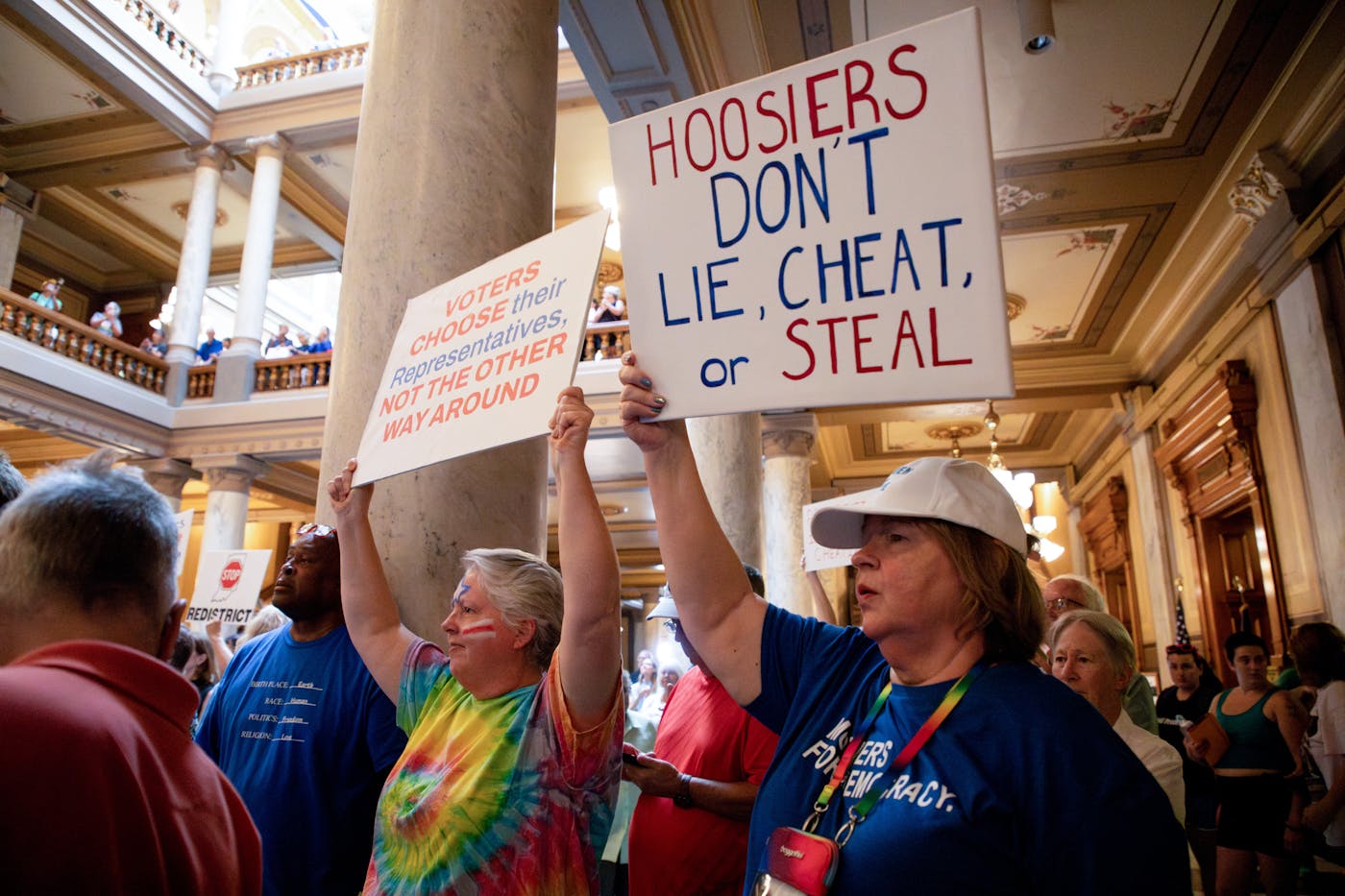 A photo of demonstrators rally against redistricting at the Indiana Statehouse in Indianapolis.