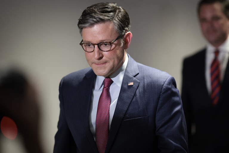 Mike Johnson looks down as he walks