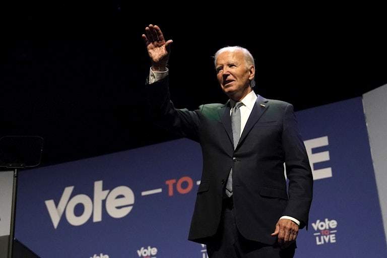 Joe Biden waves onstage