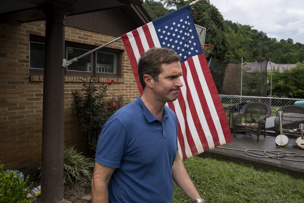 Beshear visits a house with flood damage in Whitesburg, Kentucky