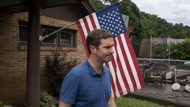 Beshear visits a house with flood damage in Whitesburg, Kentucky