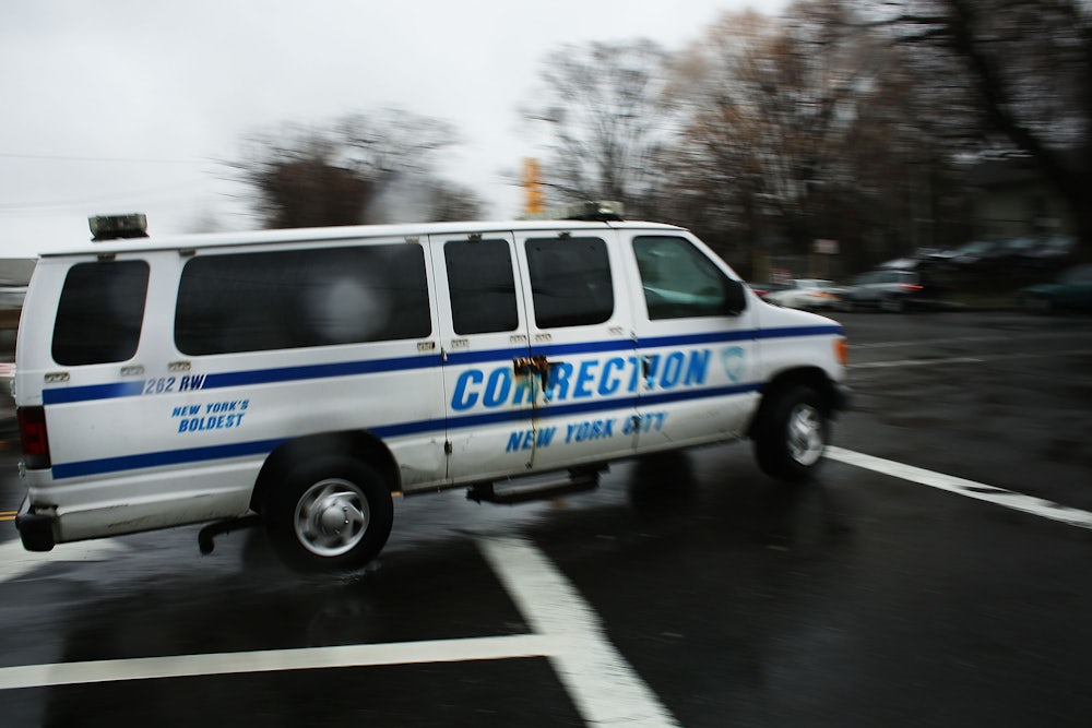 corrections officers van enters Rikers Island