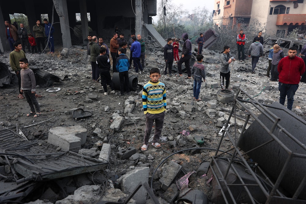 On Thursday, January 16, in Jabalia, Gazans check the rubble of buildings hit in Israeli strikes the previous night, following the announcement of a ceasefire deal.