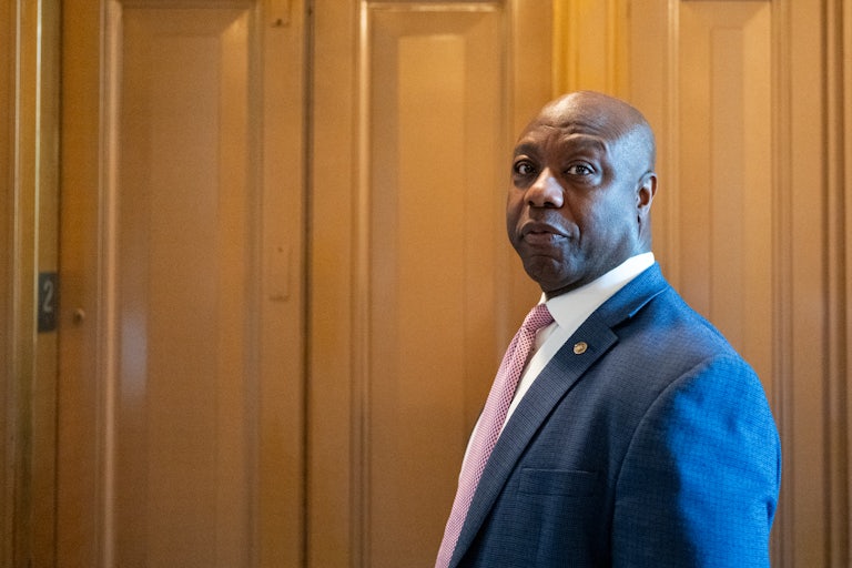 Tim Scott looks to his side