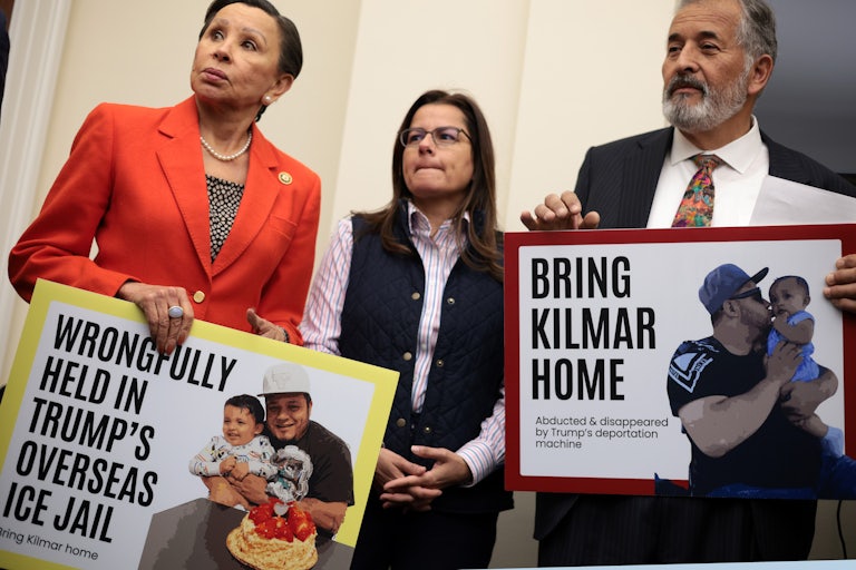 Representatives Nydia Velazquez and Juan Vargas hold up signs protesting for the return of Kilmar Abrego Garcia
