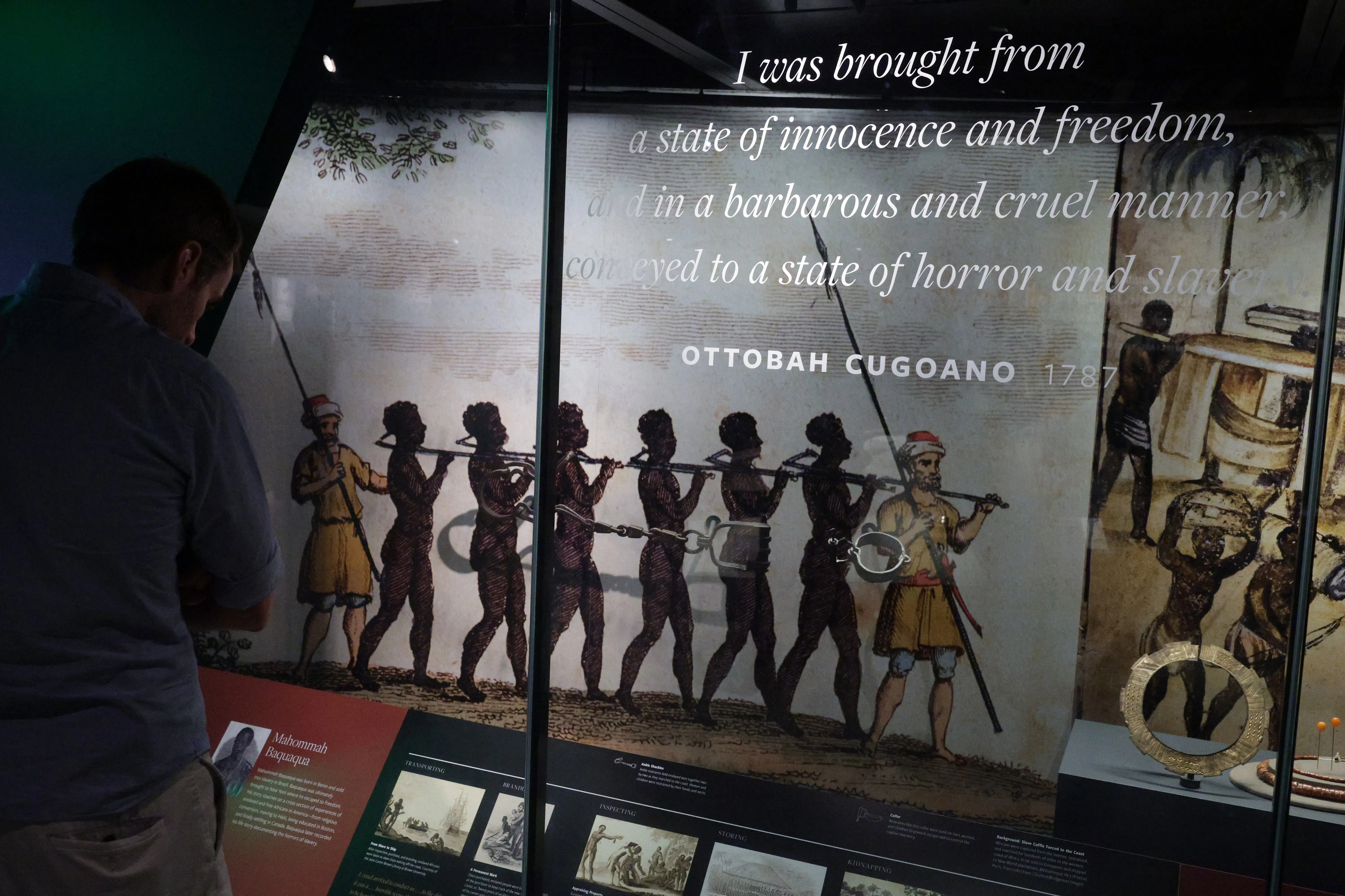 A museum exhibit showing slaves led in bondage.