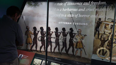 A museum exhibit showing slaves led in bondage.