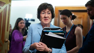 Susan Collins arrives for a committee hearing.