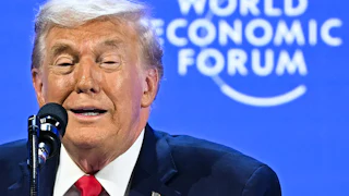Donald Trump speaks into a microphone at the World Economic Forum in Davos