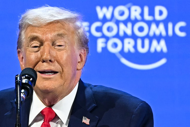 Donald Trump speaks into a microphone at the World Economic Forum in Davos