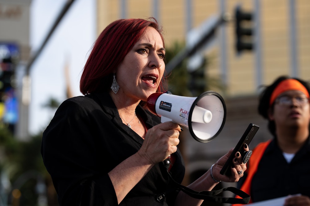 Amy Vilela speaks into a megaphone.