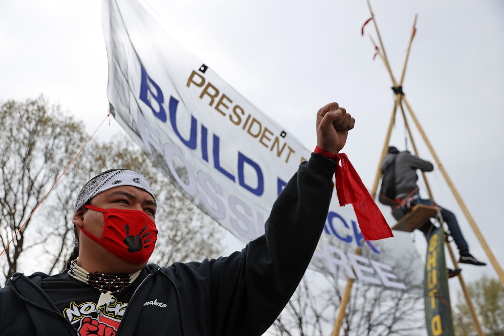 A protester holds a fist in the air.