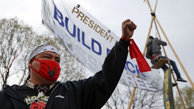 A protester holds a fist in the air.