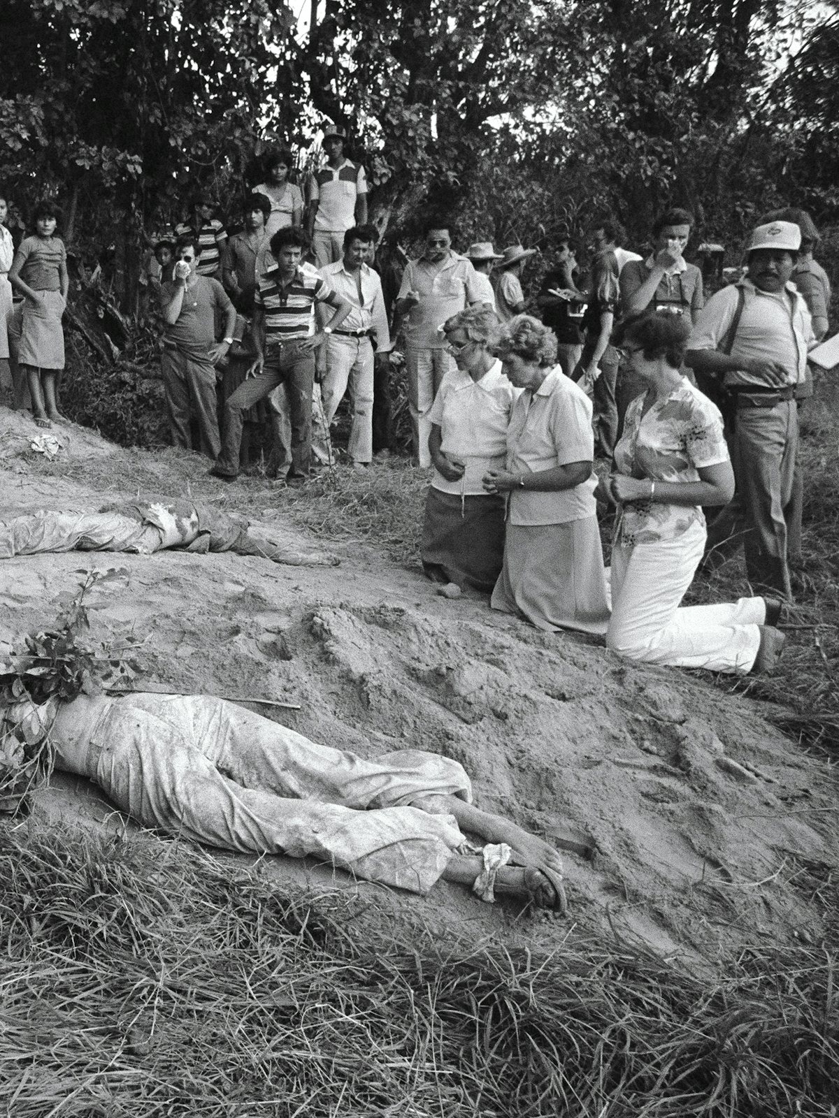A photo of the bodies of American Nuns Maura Clarke, Dorothy Kazel, and Ita Ford, along with lay missioner Jean Donovan