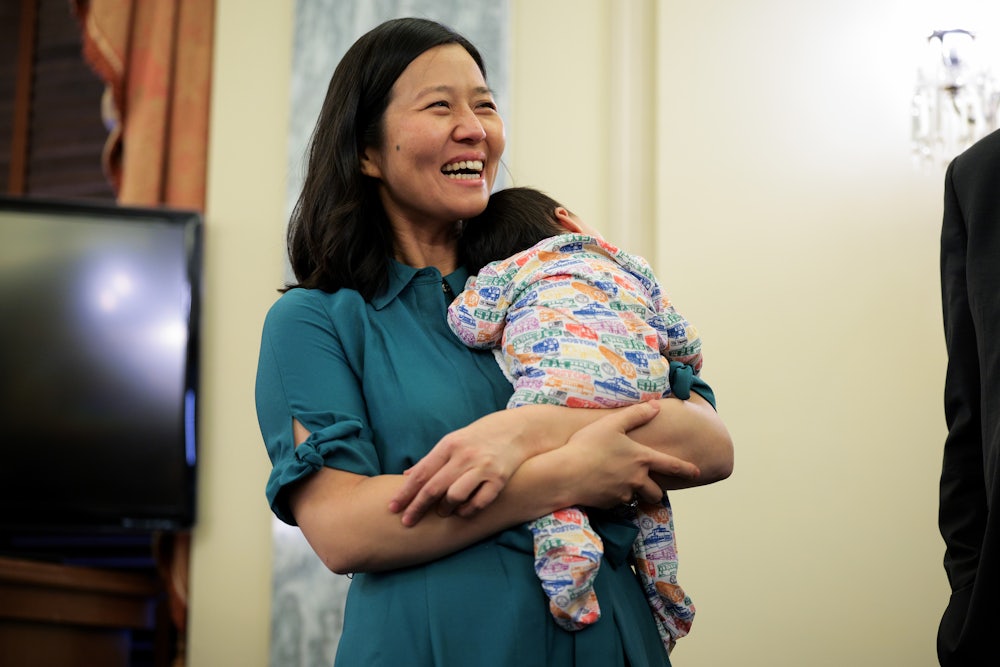 Boston Mayor Michelle Wu holds her baby before a press conference