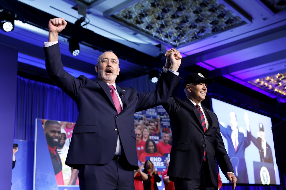 Shawn Fain, president of the United Auto Workers, with President Biden