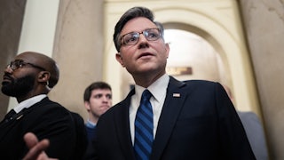 House Speaker Mike Johnson walks in the Capitol
