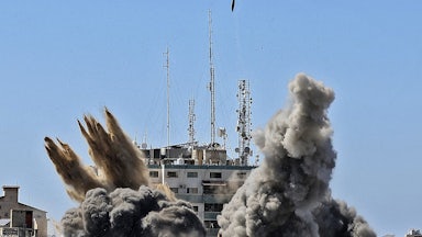 Israel's air force targets the 13-floor Jala Tower housing Qatar-based Al-Jazeera television and the Associated Press news agency