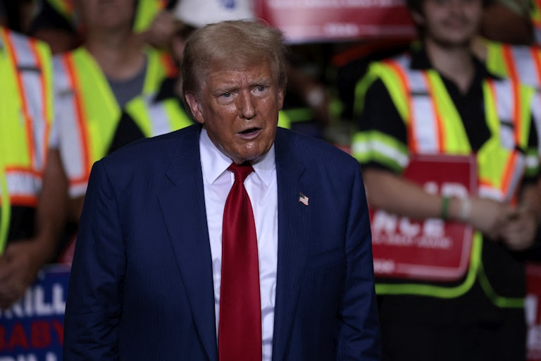 Donald Trump looks shocked at a campaign rally